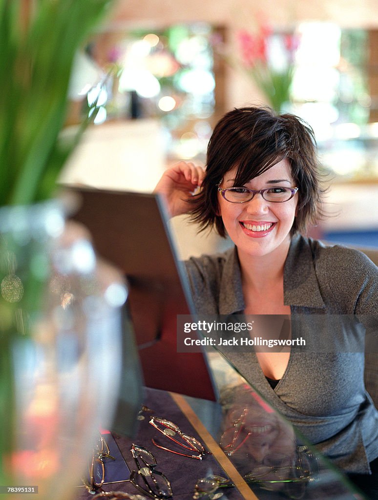 Woman trying on eyeglasses