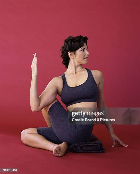 woman doing yoga - spinal twist stock pictures, royalty-free photos & images