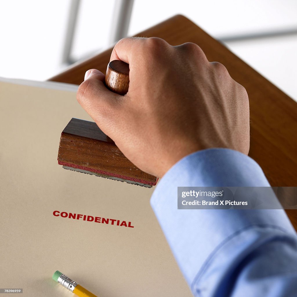 Hand stamping confidential documents