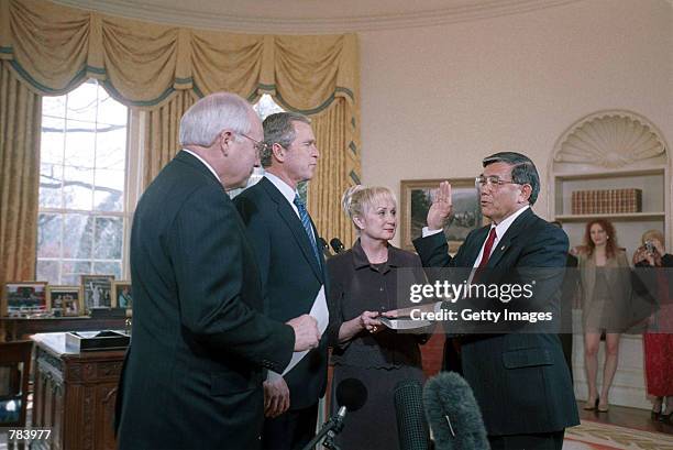 Vice President Dick Cheney, left, swears in Norman Mineta as Transportation Secretary in the Oval Office February 8, 2001 at the White House in...