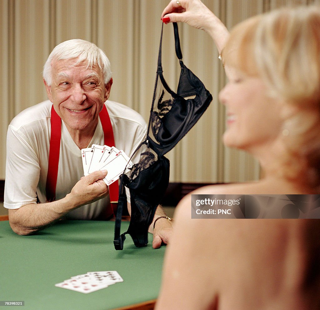 Senior man winning strip poker