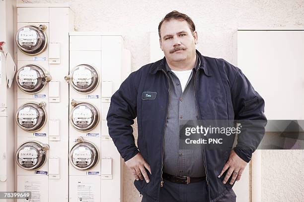 portrait of meter reader - macho stockfoto's en -beelden