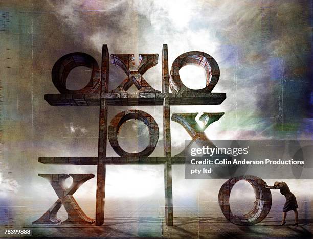 woman playing tic tac toe - tic tac toe stock pictures, royalty-free photos & images