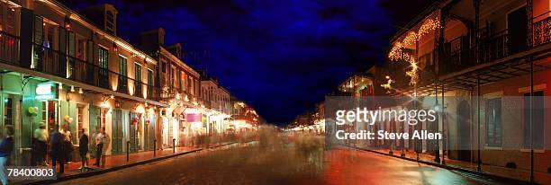 bourbon street at night, new orleans - bourbon street new orleans stock pictures, royalty-free photos & images