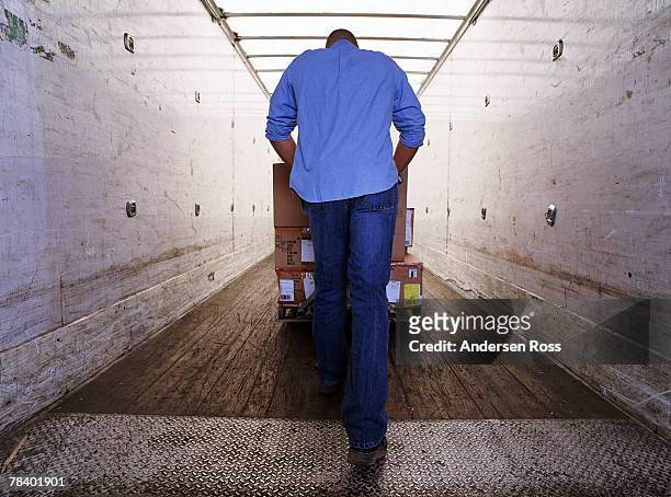 worker at loading dock - dump truck stock-fotos und bilder