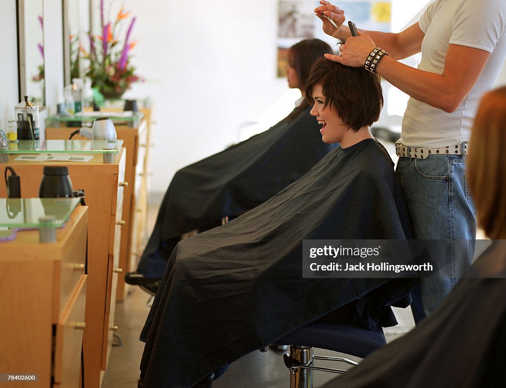 Woman getting haircut