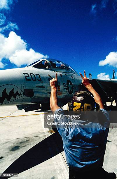crewman signaling pilot in jet - 1982 stock pictures, royalty-free photos & images