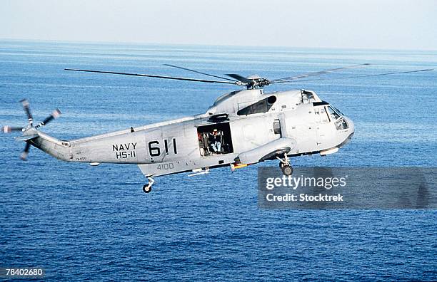 military helicopter at sea - sea king stock pictures, royalty-free photos & images