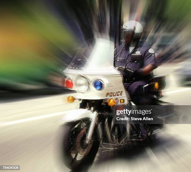 cop riding motorcycle - highway patrol stockfoto's en -beelden