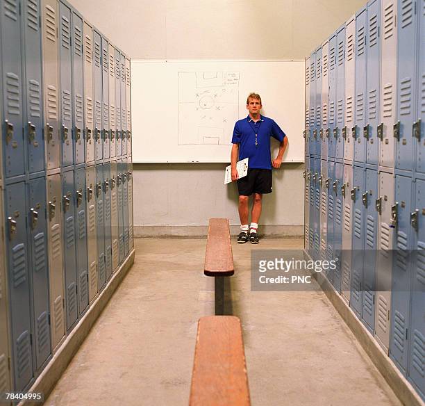 soccer coach in locker room - locker room ストックフォトと画像