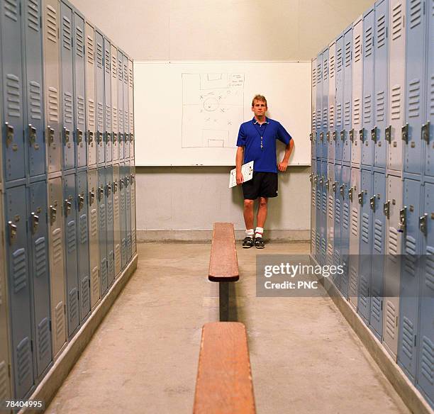 soccer coach in locker room - football locker room stock pictures, royalty-free photos & images