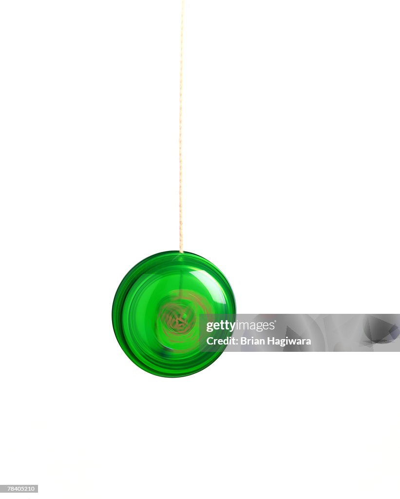 Green yo-yo on white