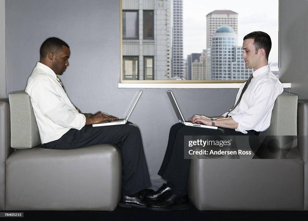 Businessmen with laptop computers