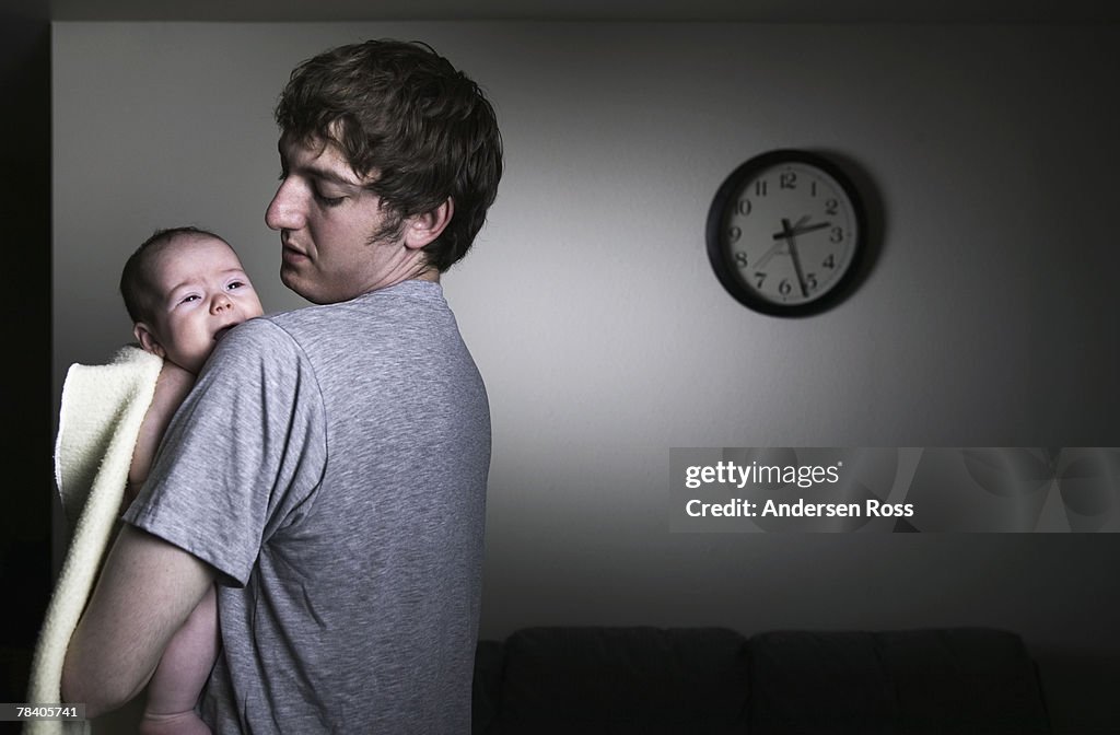 Father comforting crying baby