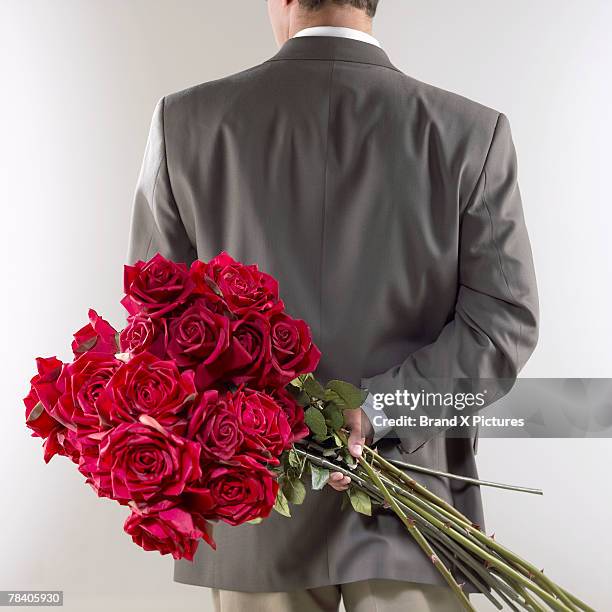 Man Among Roses 5,082 Man Holding Roses Stock Photos, High-Res Pictures, and Images ...
