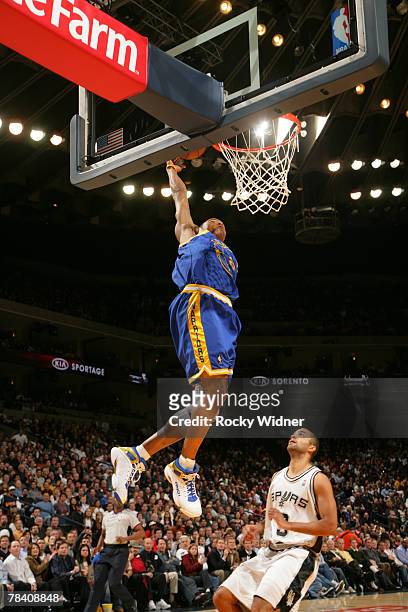 Monta Ellis of the Golden State Warriors goes for the dunk against the San Antonio Spurs on December 11, 2007 at Oracle Arena in Oakland, California....