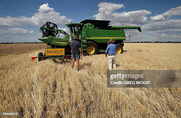 Australia-drought-commodities-wheat,FEATURE by Madeleine Coorey This photo dated 12 November, 2007 shows a dry and stunted barley crop being prepared...