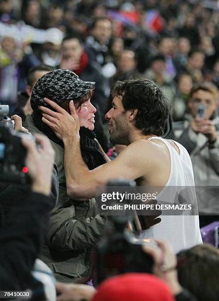 Real Madrid's Dutch Ruud Van Nistelrooy kisses an unidentified woman after beating Lazio 3-1 in a Champions League Group C football match against...