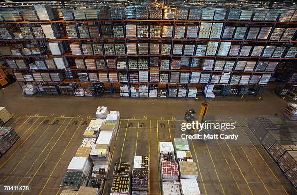 Fork lift truck moves about the racks at the giant distribution centre in Avonmouth on December 12 2007 near Bristol, England. The giant warehouse,...