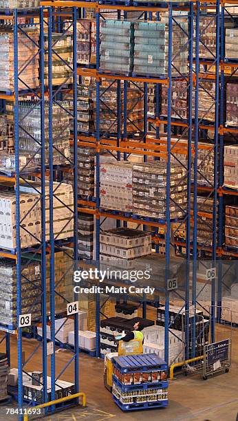 Fork lift truck moves about the racks at the giant distribution centre in Avonmouth on December 12 2007 near Bristol, England. The giant warehouse,...