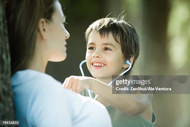 mother and son, boy pretending to be doctor - children playing doctor photos et images de collection