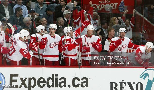 Members of the Detroit Red Wings on the bench celebrate a goal against the Montreal Canadiens during their NHL game at the Bell Centre on December 4,...