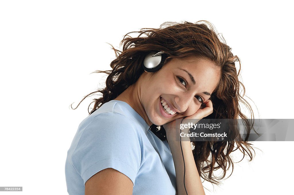 Teenage girl listening to headphones