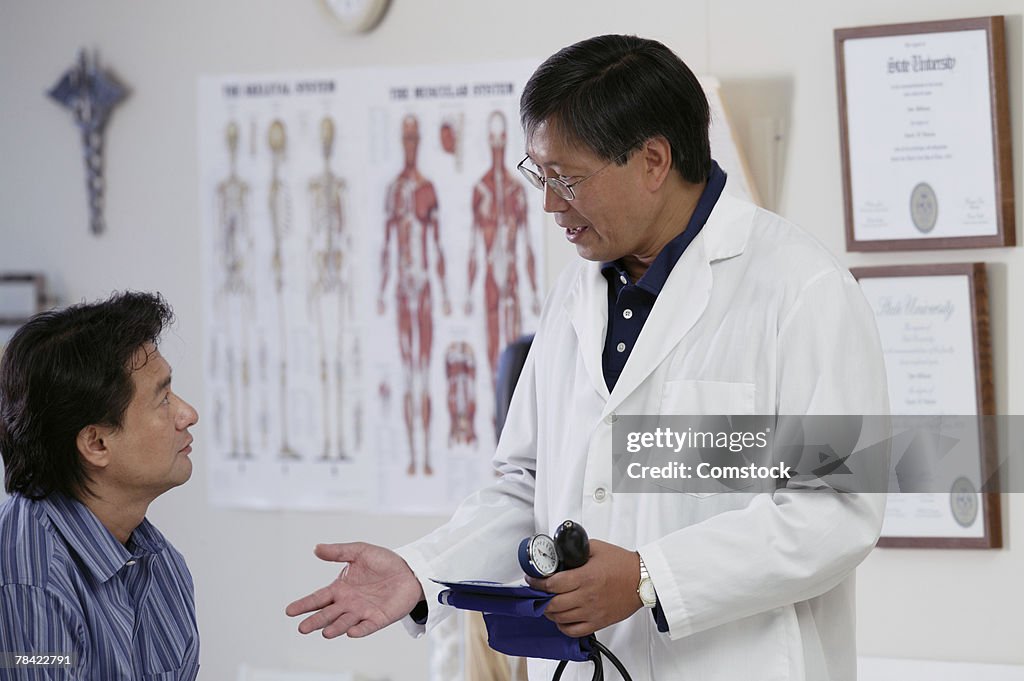 Doctor counseling patient about blood pressure