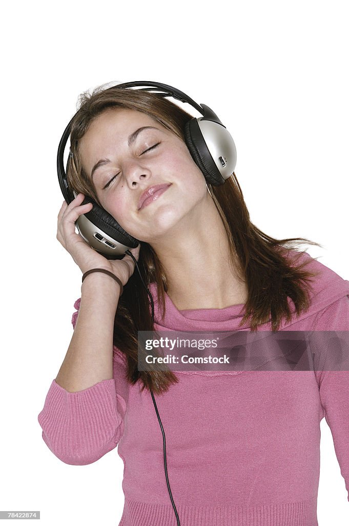 Teenager listening to headphones