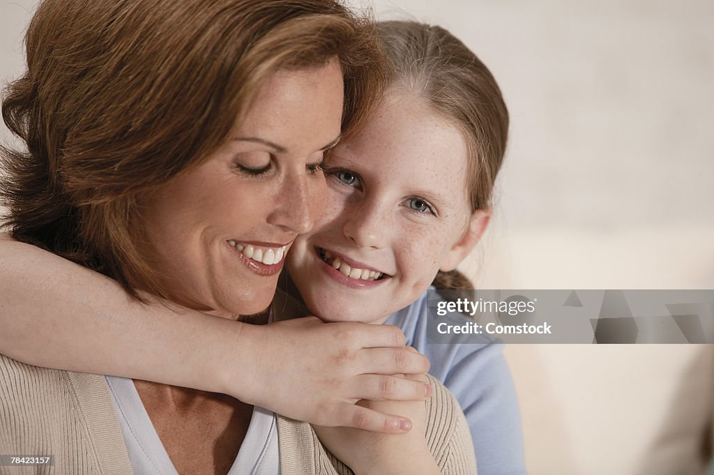 Mother and daughter embracing