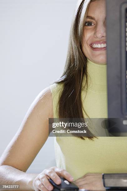 Hiding Behind Computer Screen Photos and Premium High Res Pictures ...