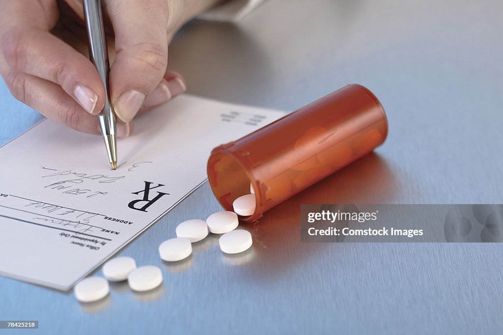 Person with prescription and medication