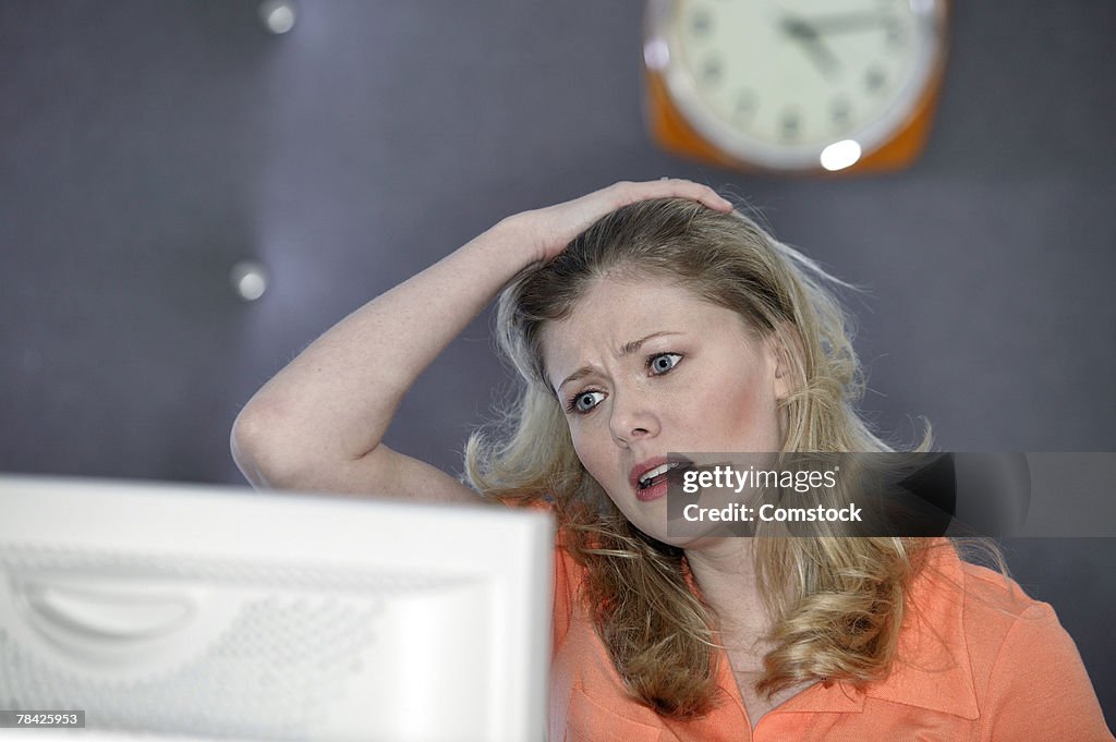 Frustrated woman at computer