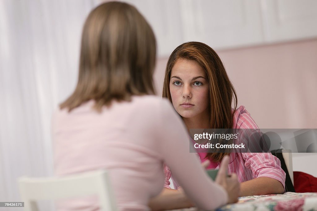 Mother and daughter talking seriously