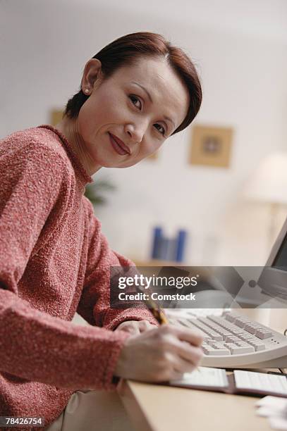 Woman Writecheck Writing A Check Bank Photos and Premium High Res Pictures - Getty Images