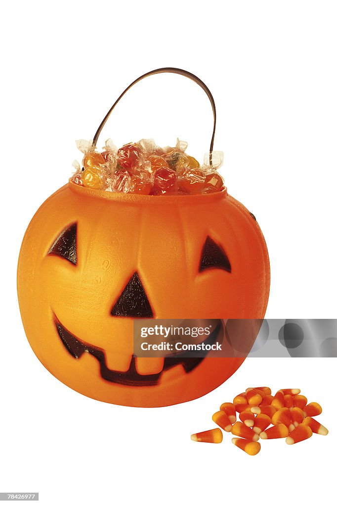 Jack-o'-lantern bucket filled with Halloween candy