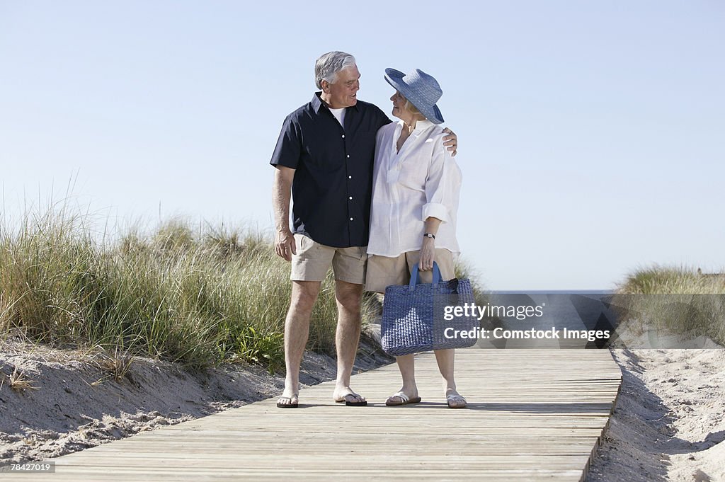 Couple walking along boardwalk