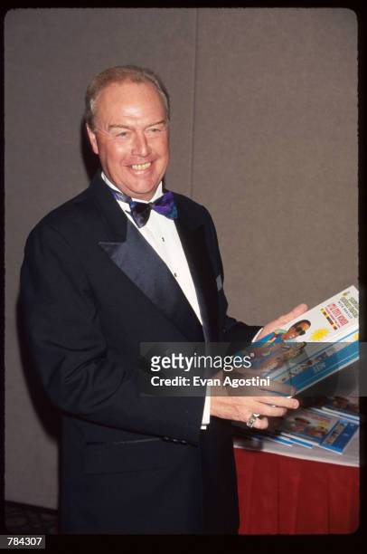 Michael Quinlan holds a book June 25, 1996 in New York City. The American Foundation for the Blind honored McDonald's CEO Quinlan, musician Stevie...