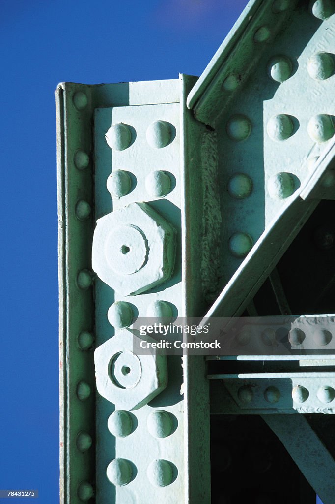 Nuts and bolts in steel girders with rivets