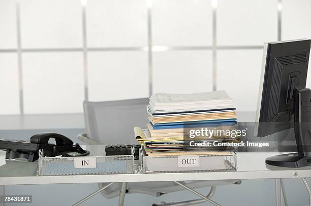 documents piled in outbox - in tray stock pictures, royalty-free photos & images