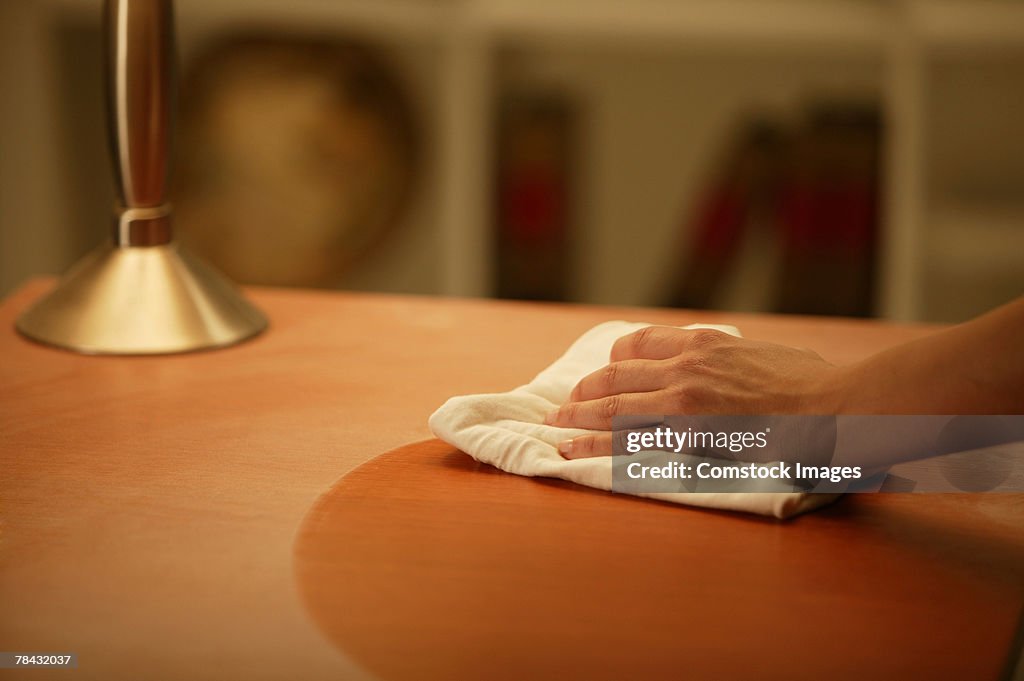 Person wiping table