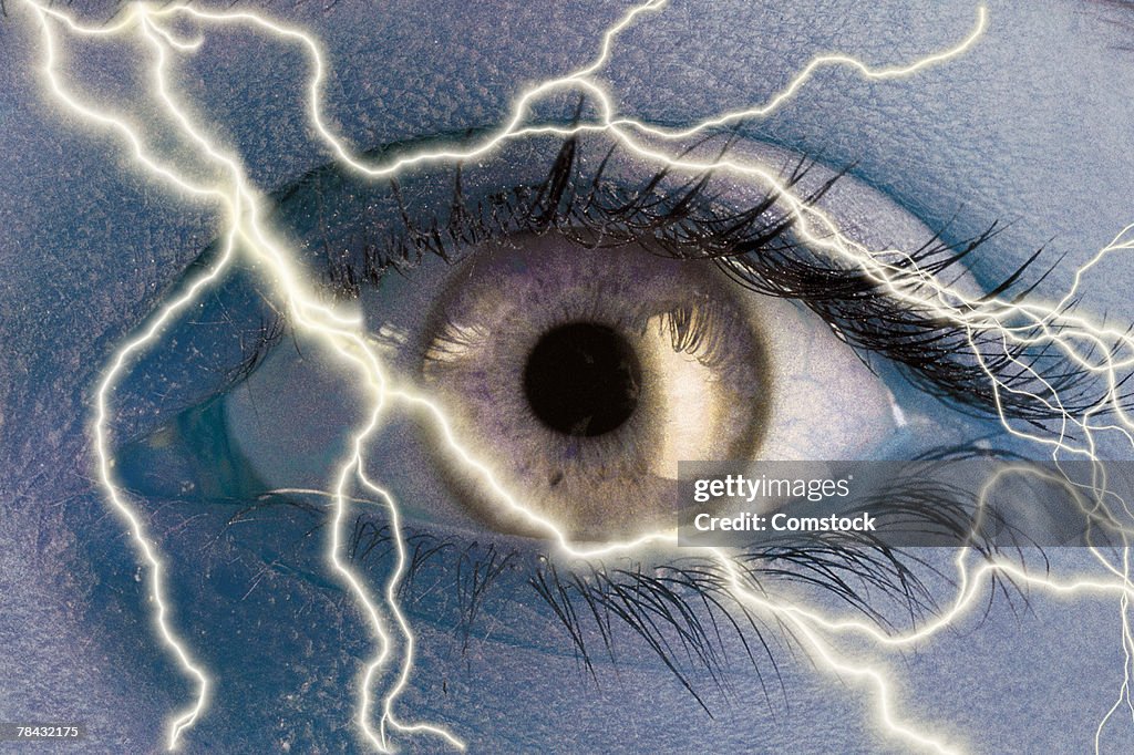 Composite of lightning bolts and human eye