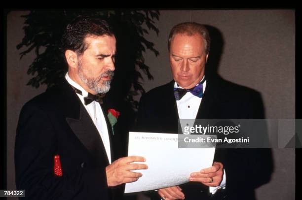 Executive Director of the American Foundation for the Blind Carl Augusto and Michael Quinlan hold a piece of paper June 25, 1996 in New York City....