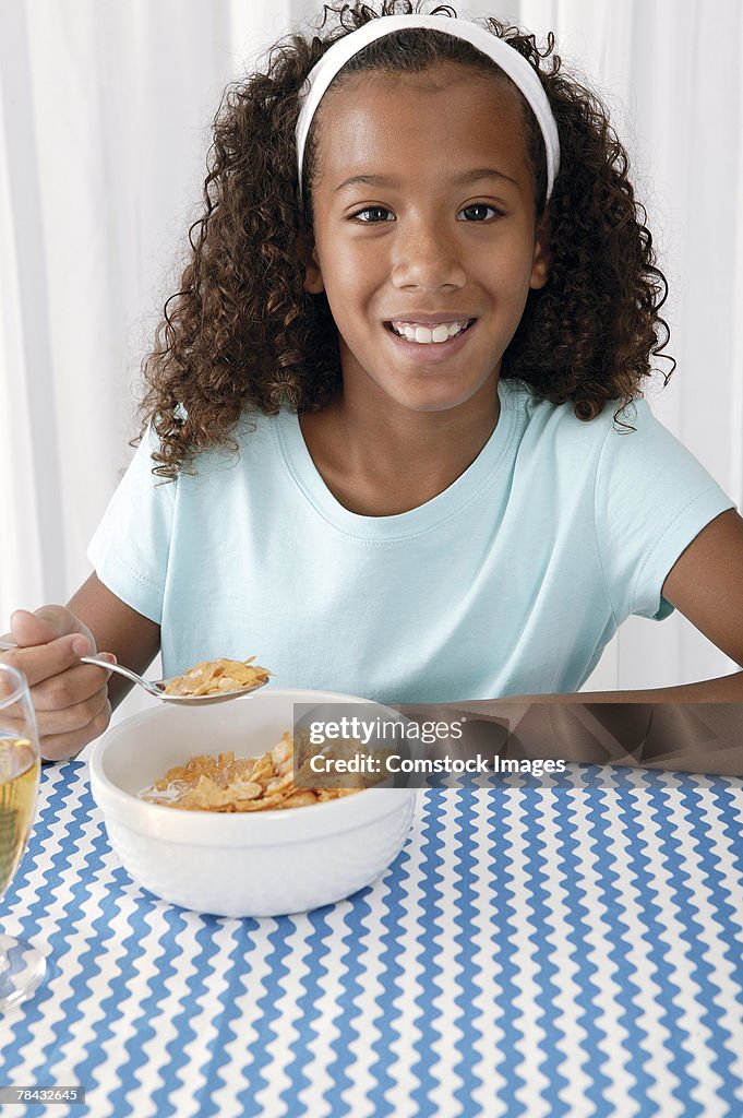 Girl eating breakfast at home