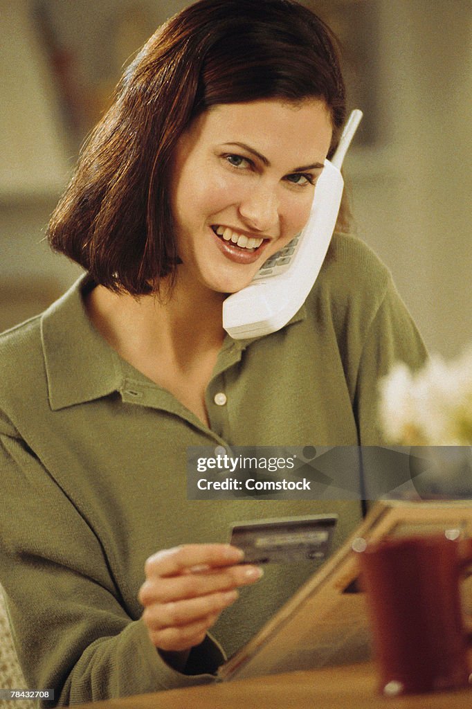 Woman ordering from catalog over the phone