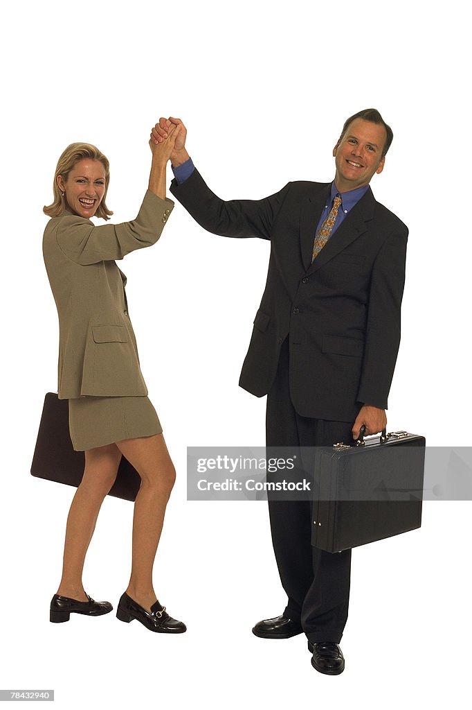 Businessman and woman congratulating, each other