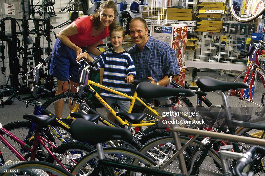 Parents shopping for new bike with son