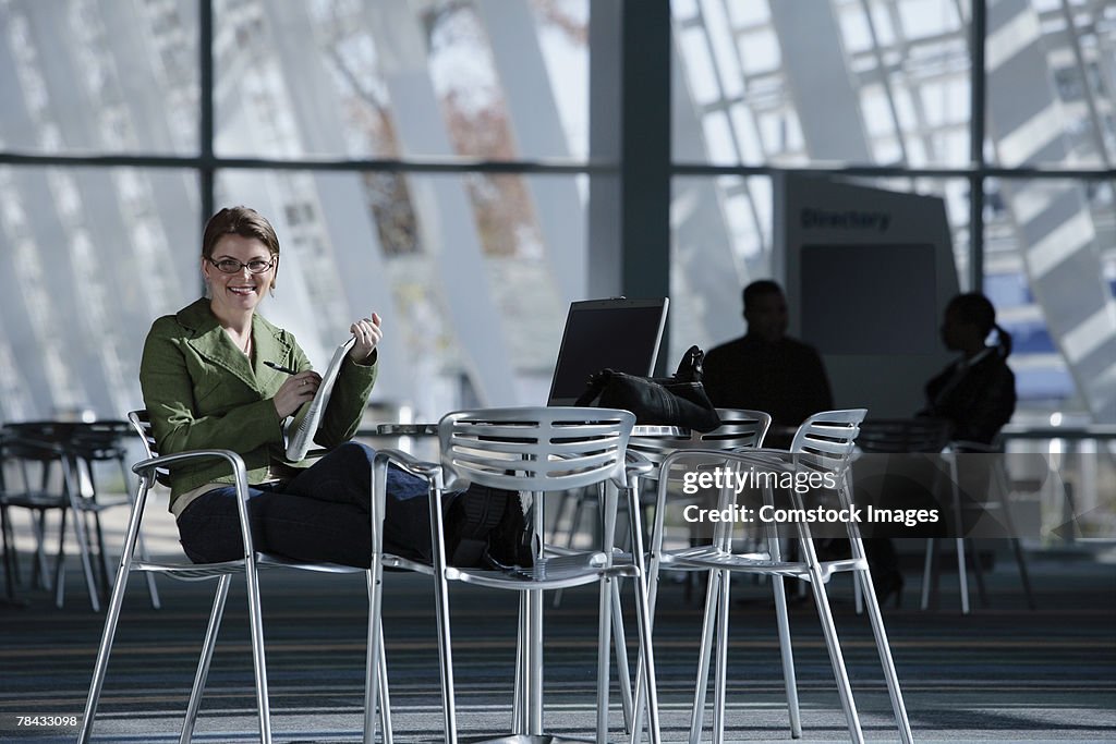 Woman with newspaper