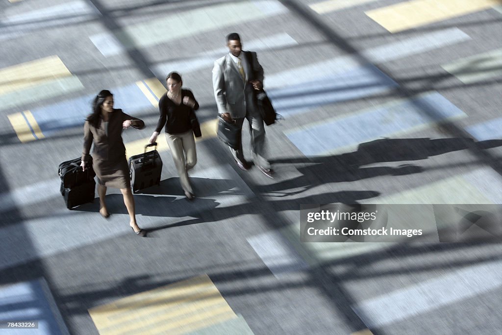 Businesspeople walking in airport