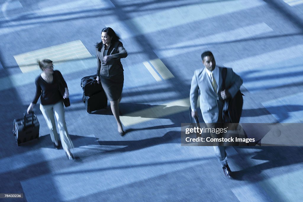 Businesspeople with luggage